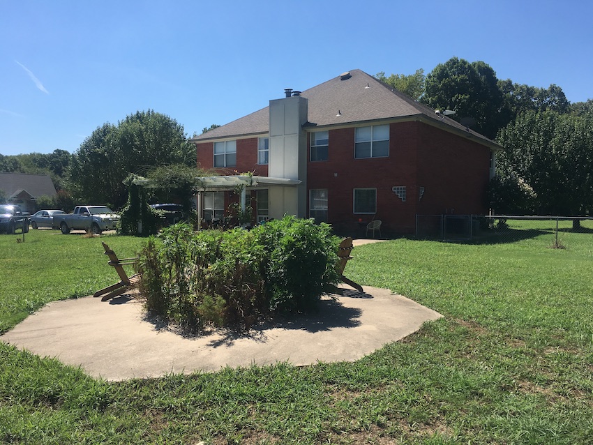 Back of Ranch House with no landscaping